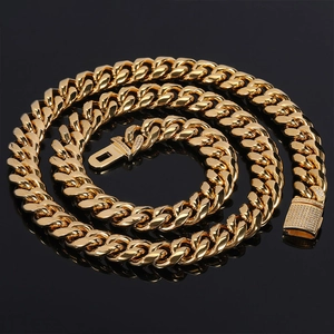 Macro shot of 12mm gold-plated Cuban link necklace with zircon-encrusted flip-over clasp