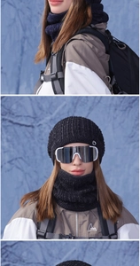 Detail of black knit beanie and thick neck warmer with reflective silver ski goggles