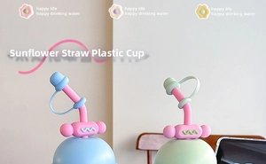 Close-up of cute sunflower straw cups in pastel blue and pink with dome lids