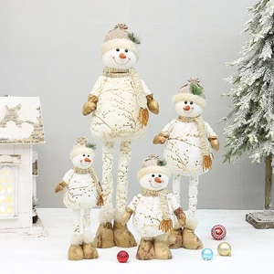 Set of four plush Christmas snowmen with gold leaf patterns and champagne knit accessories
