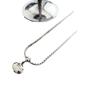 Minimalist silver bead necklace with box chain and pebble-shaped metal pendant for women