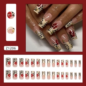 French leopard print press-on nails with red floral art and golden beads decoration