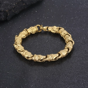 Macro shot of gold punk snake bracelet showing detailed embossed scales and textures