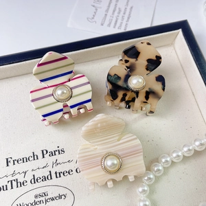 French vintage acetate hair claws with pearls in striped and tortoise shell patterns