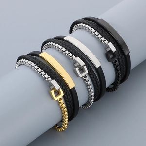 Detail of multi-layer braided leather and stainless steel bracelet with magnetic clasp