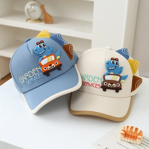 Kids baseball cap featuring 3D cartoon dinosaur and car patterns in blue and beige colors