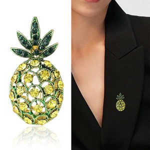 Sparkling pineapple brooch with yellow crystals on black suit lapel for stylish look