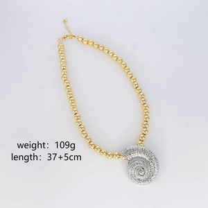 Beaded gold necklace with silver spiral seashell pendant beach style jewelry for women