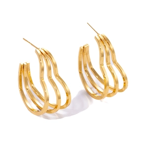 Detailed close-up of gold-plated triple-layered wavy heart-shaped stud earrings