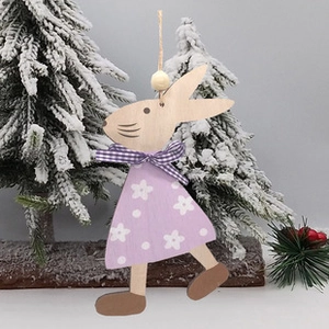 Close-up of wooden Easter bunny ornament featuring a purple floral dress and plaid bow