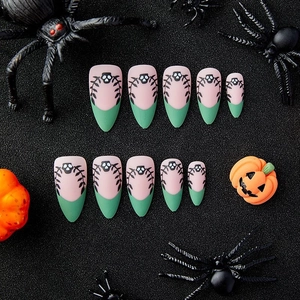 Halloween almond fake nails with pink and green French tips and skull vine patterns
