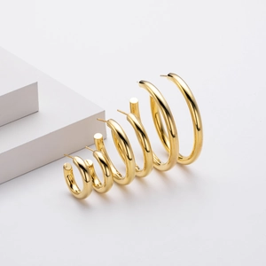 Three sizes of polished gold S925 sterling silver C-shaped hoop earrings on white background