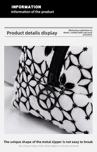 Detail of durable black and white floral fabric pouch with sturdy round metal zipper