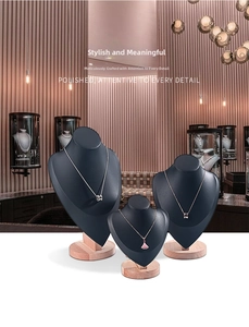 Three-piece black jewelry necklace bust set with solid wooden bases for display