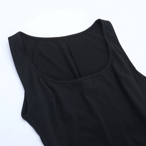 Detail view of U-shaped neckline and fine stitching on a black knitted bodysuit
