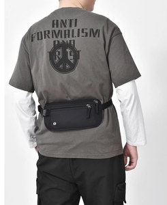 Rear view of model wearing a black waterproof RFID blocking travel money belt for security