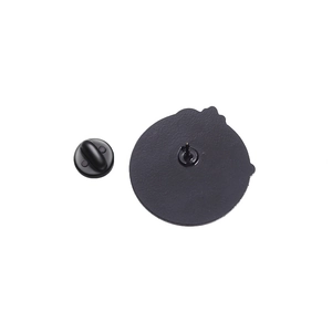 Close-up of black enamel pin back with matte finish and secure rubber clutch