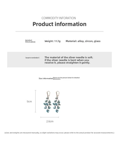 Detail of tassel earrings with blue and green gradient hearts and zircon accents