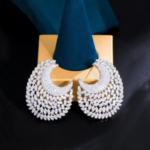 Elegant silver moon-shaped hoop earrings with micro-paved cubic zirconia for gala events