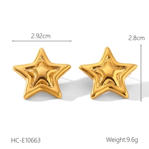 Detailed view of 2.8cm golden star stud earrings with a 3D textured metallic finish