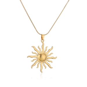 Close-up of a gold-plated sunflower pendant with wavy rays on a fine snake chain