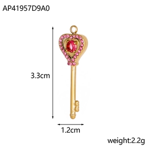 Golden heart key pendant with pink rhinestones, measures 3.3cm high and 1.2cm wide