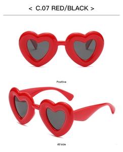 Front and 45-degree views of red heart-shaped sunglasses with polarized black lenses