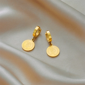 French vintage gold coin earrings with Elizabeth II pendant on champagne silk background