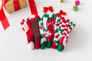 Detail view of 6-pair Christmas fuzzy socks set with reindeer and Santa patterns