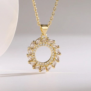 Elegant gold-plated geometric pendant necklace with sparkling cubic zirconia wreath design