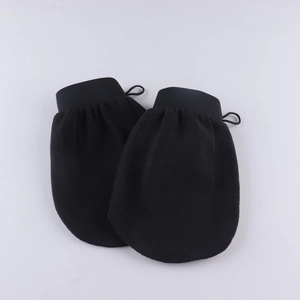 Exfoliating black scrub gloves with textured matte fabric and hanging loops for deep cleaning
