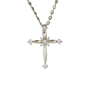 Elegant S925 sterling silver cross necklace in gold with sparkling gemstones on white