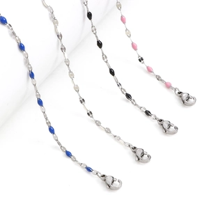 Detail showing stainless steel curb chains with colorful enamel beads and lobster clasps