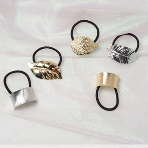 Minimalist metallic hair ties set with gold and silver leaf charms and elastic bands