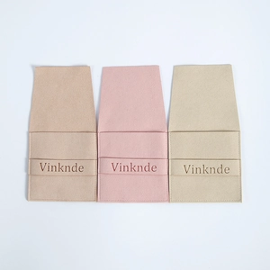 Microfiber jewelry envelope pouches in khaki, pink, and beige with Vinknde logo