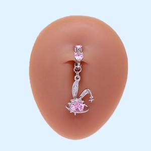 Silver heart navel ring with pink gemstone and rabbit pendant on silicone model