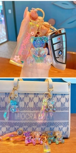 Macro shot of 3D crystal bear keychain with gradient finish and gold metal lobster clasp
