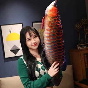 Macro detail of realistic golden arowana plush pillow with fish scale texture and side zipper