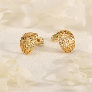 Detailed macro view of 18K gold plated semi-circular studs with hollow mesh pattern