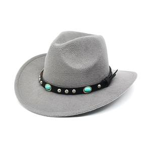 Detail of grey felt cowboy hat with turquoise and metal studs on black leather band