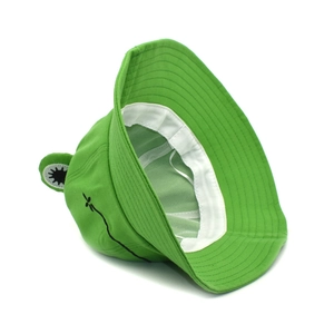 Detailed side view of green frog bucket hat showing interior sweatband and eye decor
