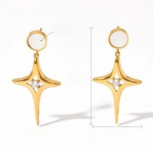 Detail of gold star drop earrings with mother of pearl inlay and crystal, 39.5x20mm size