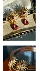 Detailed close-up of vintage sunflower earrings with rose red crystals and gold finish