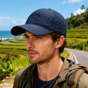 Quilted navy blue men's winter hat with embroidery for outdoor insulation and protection