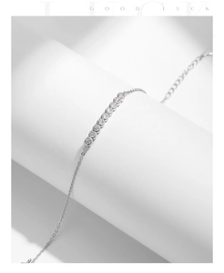 Detailed view of s925 silver bracelet with ten round sparkling moissanite stones
