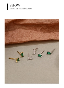 Detailed view of sterling silver square stud earrings with green and white cubic zirconia