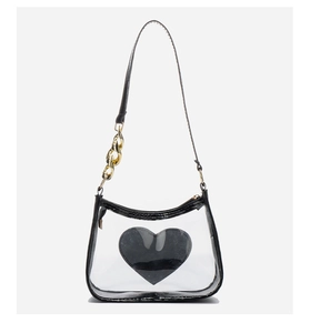 Transparent PVC crossbody bag with black heart logo detail and gold chain strap