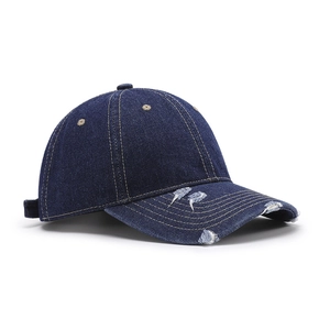 Vintage navy blue washed denim baseball cap with distressed brim and contrast stitching