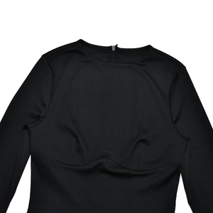 Detail of black long sleeve dress featuring back zipper and structured bodice stitching