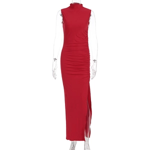 Detail of red sleeveless maxi dress showing side ruching and high slit design